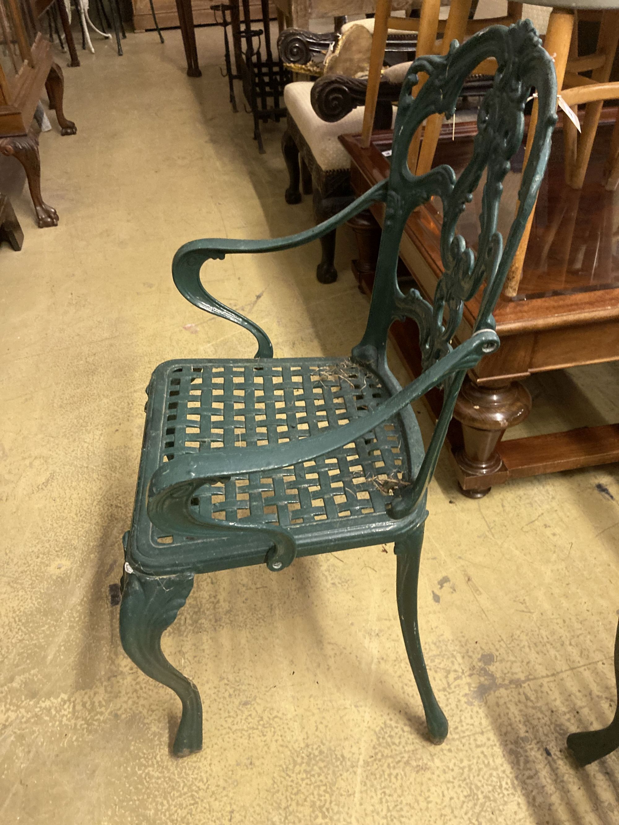 A set of four painted cast aluminium garden chairs (two with arms)